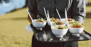 Small Bowls of Food Carried on a Serving Tray to Promote Catering Software